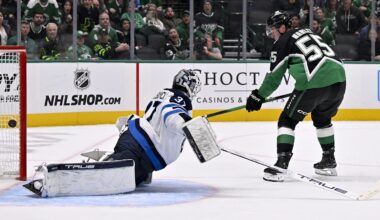 Feb 2, 2026; Dallas, Texas, USA; Dallas Stars defenseman Thomas Harley (55) scores the game winning goal against Winnipeg Jets goaltender Connor Hellebuyck (37) during the overtime period at the American Airlines Center. Mandatory Credit: Jerome Miron-Imagn Images