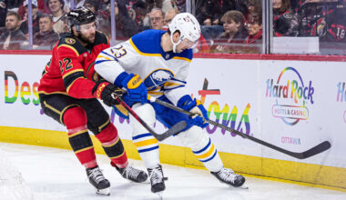Apr 2, 2026; Ottawa, Ontario, CAN; Ottawa Senators right wing Michael Amadio (22) and Buffalo Sabres defenseman Mattias Samuelsson (23) battle for the puck in the first period at the Canadian Tire Centre. Mandatory Credit: Marc DesRosiers-IMAGN Images