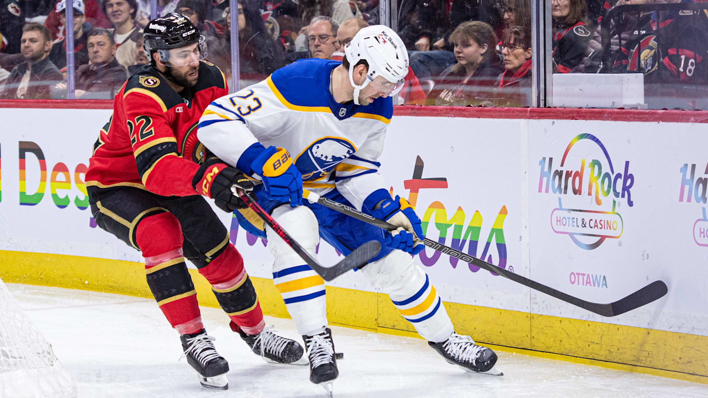 Apr 2, 2026; Ottawa, Ontario, CAN; Ottawa Senators right wing Michael Amadio (22) and Buffalo Sabres defenseman Mattias Samuelsson (23) battle for the puck in the first period at the Canadian Tire Centre. Mandatory Credit: Marc DesRosiers-IMAGN Images