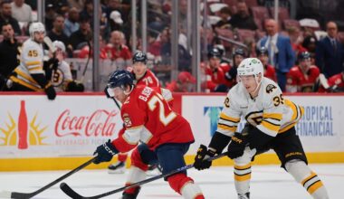 Apr 2, 2026; Sunrise, Florida, USA; Florida Panthers defenseman Tobias Bjornfot (22) moves the puck against Boston Bruins center Morgan Geekie (39) during the second period at Amerant Bank Arena. Mandatory Credit: Sam Navarro-Imagn Images