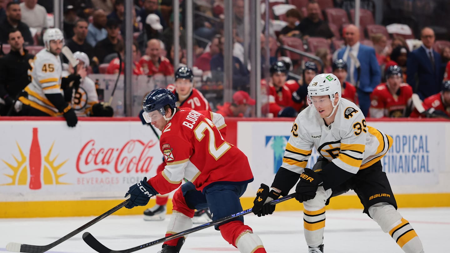 Apr 2, 2026; Sunrise, Florida, USA; Florida Panthers defenseman Tobias Bjornfot (22) moves the puck against Boston Bruins center Morgan Geekie (39) during the second period at Amerant Bank Arena. Mandatory Credit: Sam Navarro-Imagn Images
