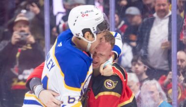 Apr 2, 2026; Ottawa, Ontario, CAN; Buffalo Sabres defenseman Logan Stanley (64) fights with Ottawa Senators left wing Brady Tkachuk (7) in the first period at the Canadian Tire Centre. Mandatory Credit: Marc DesRosiers-IMAGN Images
