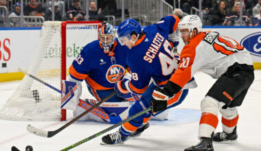 Nov 28, 2025; Elmont, New York, USA; New York Islanders defenseman Matthew Schaefer (48) and Philadelphia Flyers right wing Bobby Brink (10) battle for the puck during the third period at UBS Arena. Mandatory Credit: Dennis Schneidler-Imagn Images