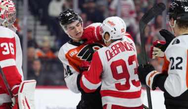 Apr 2, 2026; Philadelphia, Pennsylvania, USA; Philadelphia Flyers right wing Porter Martone (94) scuffles with Detroit Red Wings right wing Alex Debrincat (93) in the second period at Xfinity Mobile Arena. Mandatory Credit: Kyle Ross-Imagn Images