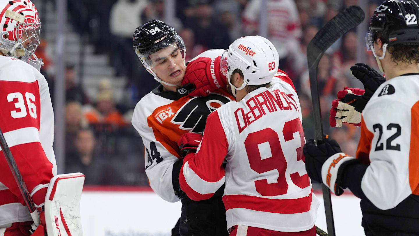 Apr 2, 2026; Philadelphia, Pennsylvania, USA; Philadelphia Flyers right wing Porter Martone (94) scuffles with Detroit Red Wings right wing Alex Debrincat (93) in the second period at Xfinity Mobile Arena. Mandatory Credit: Kyle Ross-Imagn Images