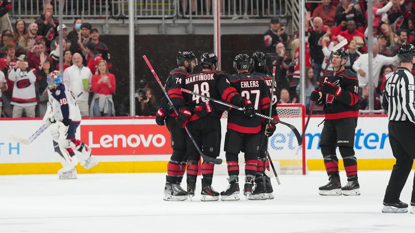 Apr 2, 2026; Raleigh, North Carolina, USA;  Carolina Hurricanes left wing Jordan Martinook (48) celebrates his goal with left wing Nikolaj Ehlers (27) defenseman Jalen Chatfield (5) center Jordan Staal (11)and  defenseman Jaccob Slavin (74) against the Columbus Blue Jackets during the second period at Lenovo Center. Mandatory Credit: James Guillory-Imagn Images