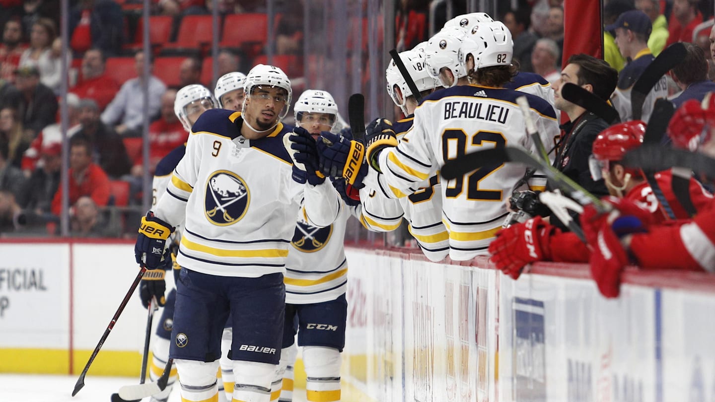 Feb 22, 2018; Detroit, MI, USA; Buffalo Sabres left wing Evander Kane (9) celebrates with teammates after scoring a goal during the second period against the Detroit Red Wings at Little Caesars Arena. Mandatory Credit: Raj Mehta-Imagn Images
