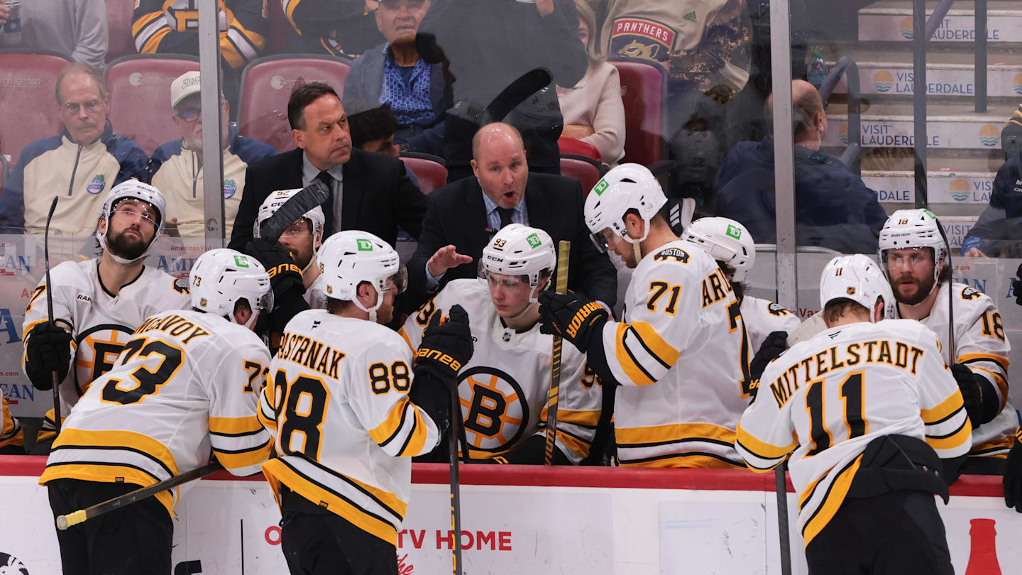 Apr 2, 2026; Sunrise, Florida, USA; Boston Bruins assistant coach Steve Spott speaks to Boston Bruins right wing David Pastrnak (88) during a timeout against the Florida Panthers in the third period at Amerant Bank Arena. Mandatory Credit: Sam Navarro-Imagn Images