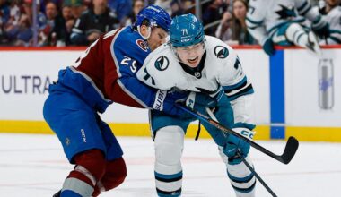 Feb 4, 2026; Denver, Colorado, USA; Colorado Avalanche center Nathan MacKinnon (29) pushes San Jose Sharks center MacKlin Celebrini (71) off the puck in the third period at Ball Arena. Mandatory Credit: Isaiah J. Downing-Imagn Images