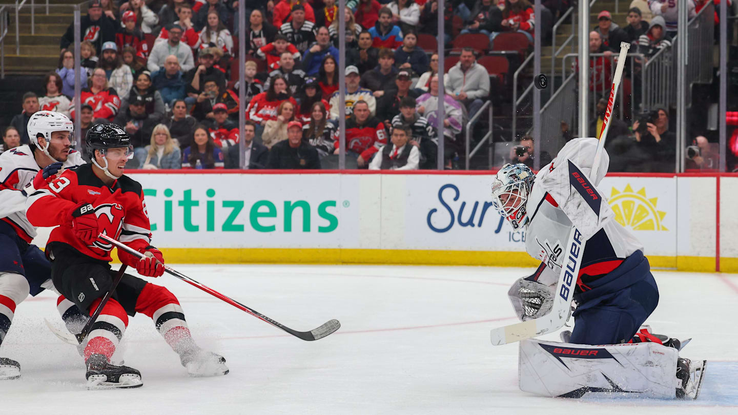 Washington Capitals goaltender Logan Thompson (48) makes a save on New Jersey Devils left wing Jesper Bratt (63): Ed Mulholland-Imagn Images