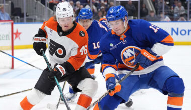 Apr 3, 2026; Elmont, New York, USA;  Philadelphia Flyers forward Trevor Zegras (46) and New York Islanders fordward Mathew Barzal (13) battle for a puck during the third period at UBS Arena. Mandatory Credit: Alexander Wohl-Imagn Images