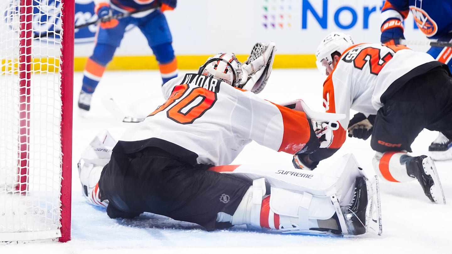 Apr 3, 2026; Elmont, New York, USA;  Philadelphia Flyers goaltender Dan Vladar (80) makes a save against the New York Islanders in the second period at UBS Arena.