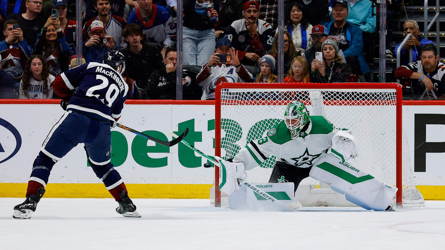 Mar 18, 2026; Denver, Colorado, USA; Colorado Avalanche center Nathan MacKinnon (29) shoots the puck wide of the net against Dallas Stars goaltender Jake Oettinger (29) in the shootout at Ball Arena. Mandatory Credit: Isaiah J. Downing-Imagn Images