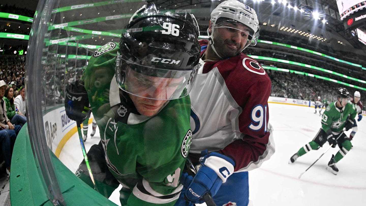 Apr 4, 2026; Dallas, Texas, USA; Colorado Avalanche center Nazem Kadri (91) checks Dallas Stars right wing Mikko Rantanen (96) during the second period at the American Airlines Center. Mandatory Credit: Jerome Miron-Imagn Images