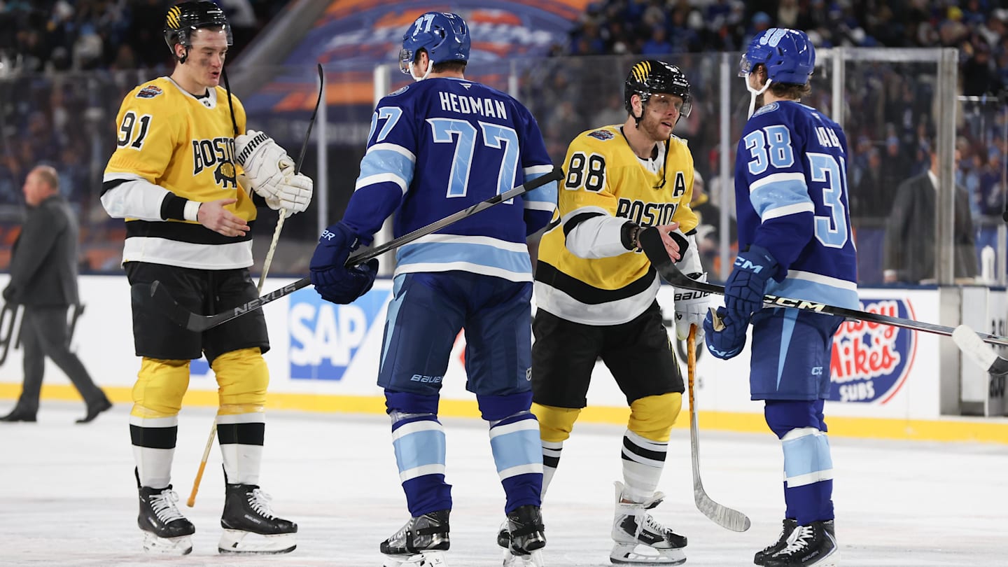 Feb 1, 2026; Tampa Bay, Florida, USA; Boston Bruins defenseman Nikita Zadorov (91) and right wing David Pastrnak (88) shake hands with Tampa Bay Lightning defenseman Victor Hedman (77) and left wing Brandon Hagel (38) following  the 2026 Stadium Series ice hockey game at Raymond James Stadium. Mandatory Credit: Kim Klement Neitzel-Imagn Images