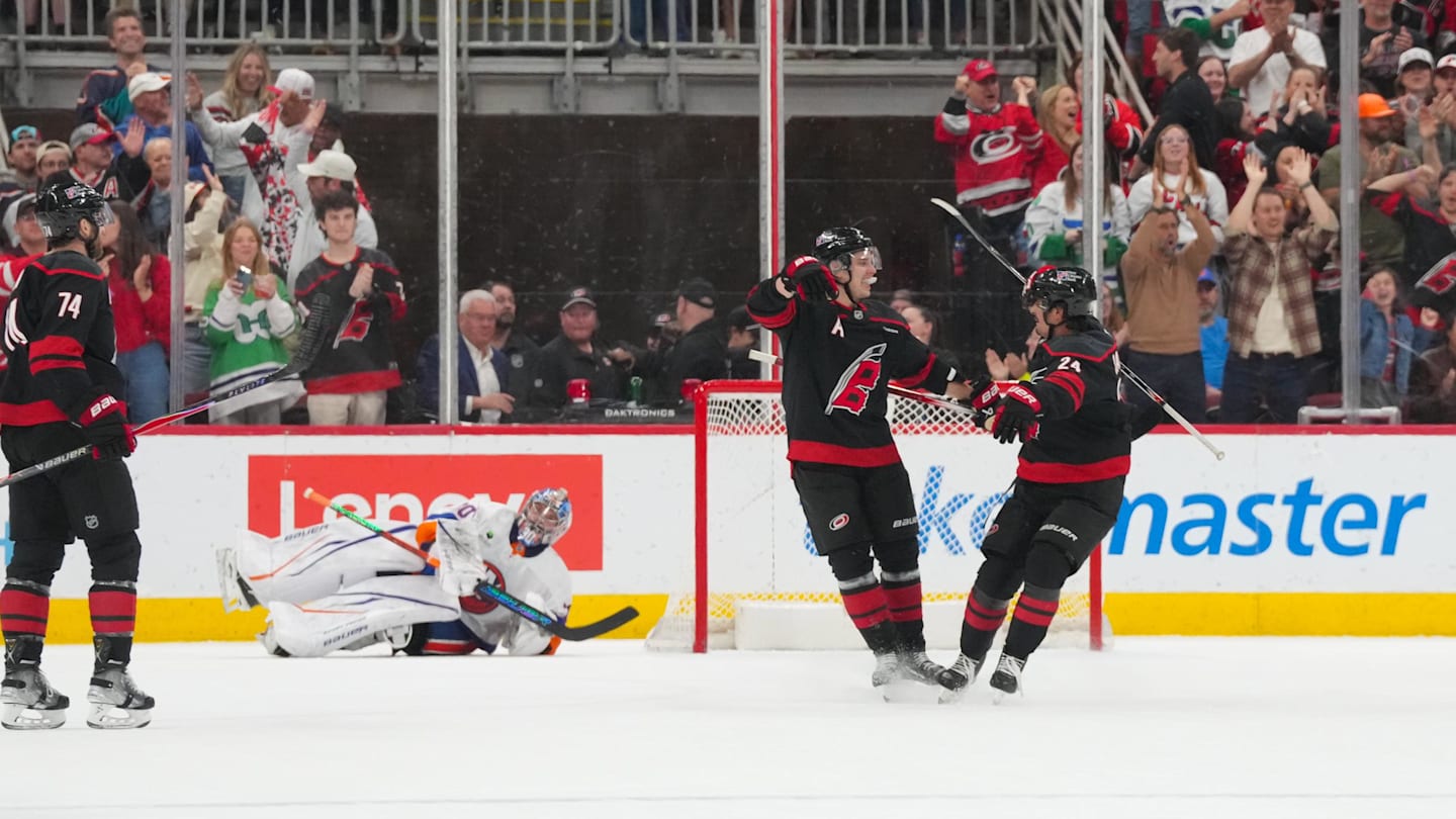 Apr 4, 2026; Raleigh, North Carolina, USA;  Carolina Hurricanes center Sebastian Aho (20) is congratulated by center Seth Jarvis (24) after his goal past New York Islanders goaltender Ilya Sorokin (30) during the second period at Lenovo Center. Mandatory Credit: James Guillory-Imagn Images