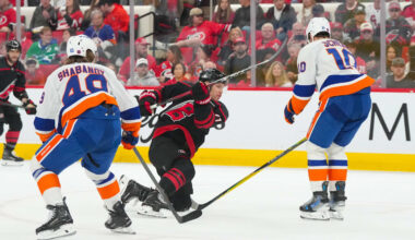 Apr 4, 2026; Raleigh, North Carolina, USA;  Carolina Hurricanes left wing Taylor Hall (71) takes a shot against New York Islanders center Brayden Schenn (10) and right wing Max Shabanov (49) during the third period at Lenovo Center. Mandatory Credit: James Guillory-Imagn Images