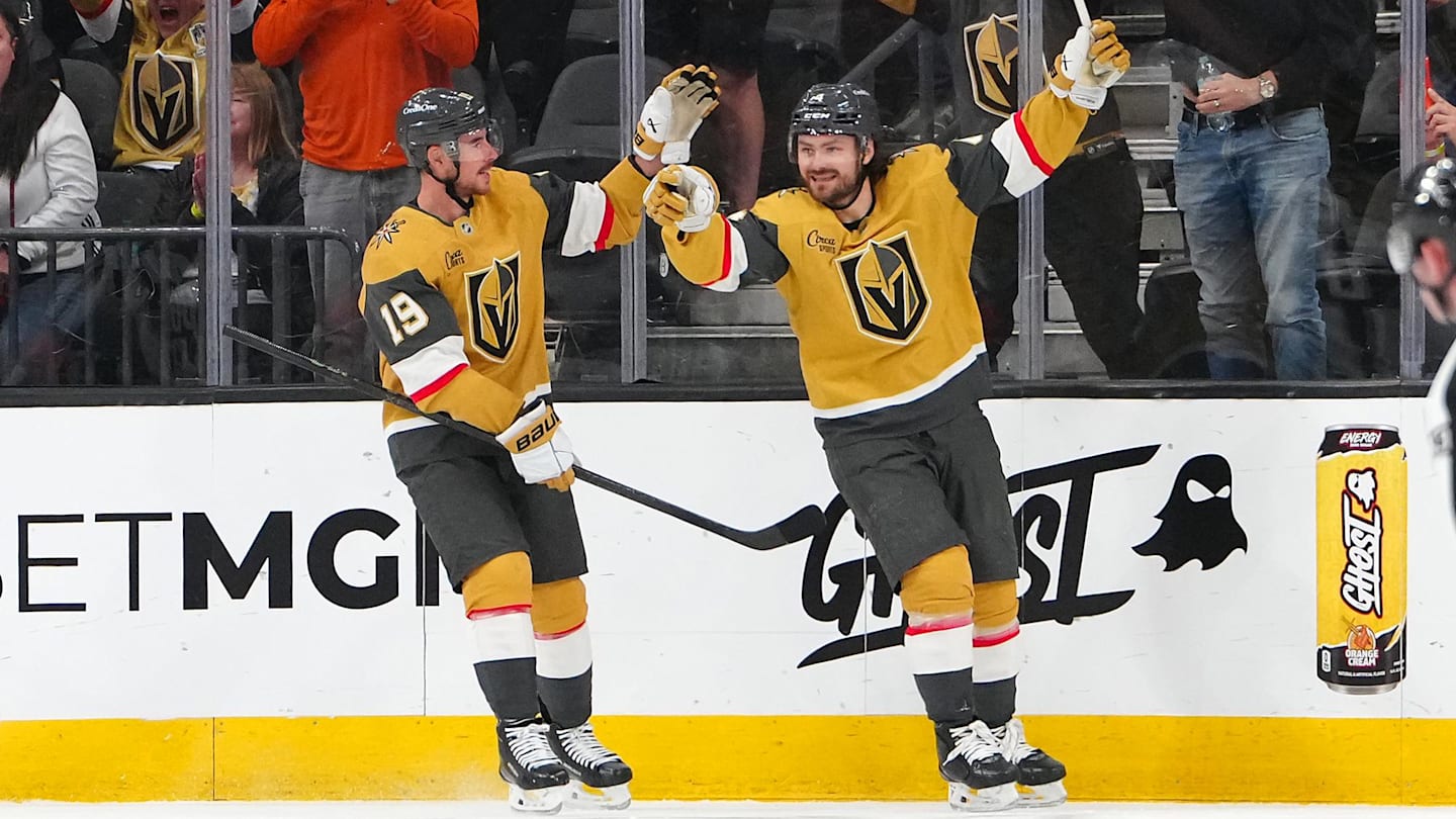 Mar 30, 2026; Las Vegas, Nevada, USA; Vegas Golden Knights defenseman Rasmus Andersson (4) celebrates with right wing Reilly Smith (19) after scoring a goal against the Vancouver Canucks during the second period at T-Mobile Arena. Mandatory Credit: Stephen R. Sylvanie-Imagn Images