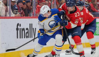 Feb 2, 2026; Sunrise, Florida, USA; Buffalo Sabres defenseman Michael Kesselring (8) protects the puck against Florida Panthers center Carter Verhaeghe (23) during the first period at Amerant Bank Arena. Mandatory Credit: Sam Navarro-Imagn Images