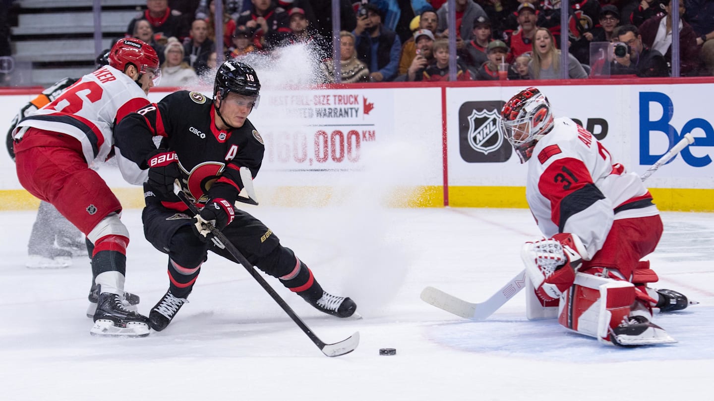 Apr 5, 2026; Ottawa, Ontario, CAN; Ottawa Senators center Tim Stutzle (18) moves the puck in front of Carolina Hurricanes goalie Frederik Andersen (31) in the first period at the Canadian Tire Centre. Mandatory Credit: Marc DesRosiers-IMAGN Images