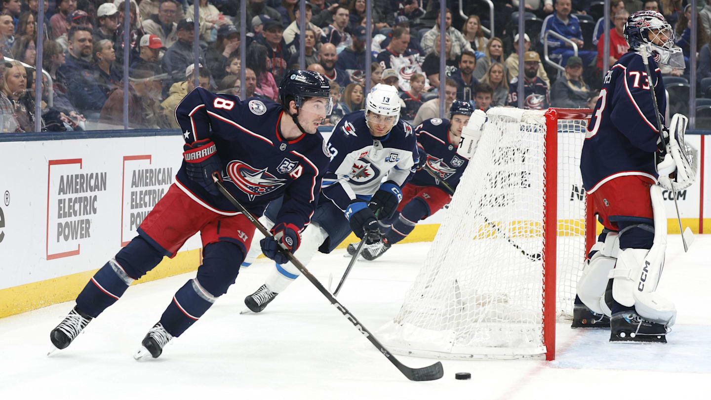 Apr 4, 2026; Columbus, Ohio, USA; Columbus Blue Jackets defenseman Zach Werenski (8) skates with the puck as Winnipeg Jets center Gabriel Vilardi (13) trails the play during the first period at Nationwide Arena. Mandatory Credit: Russell LaBounty-Imagn Images