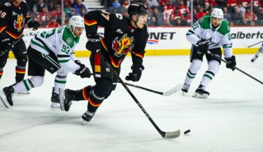 Mar 3, 2026; Calgary, Alberta, CAN; Calgary Flames defenseman Yan Kuznetsov (37) skates with the puck against the Dallas Stars during the first period at Scotiabank Saddledome. Mandatory Credit: Sergei Belski-Imagn Images