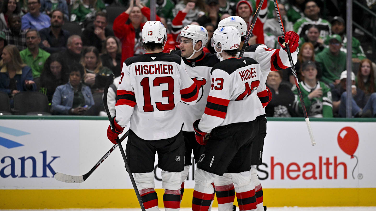 Mar 24, 2026; Dallas, Texas, USA; New Jersey Devils center Nico Hischier (13) and defenseman Luke Hughes (43) and right wing Timo Meier (28) celebrates a goal scored by Meier against the Dallas Stars during the third period at the American Airlines Center. Mandatory Credit: Jerome Miron-Imagn Images