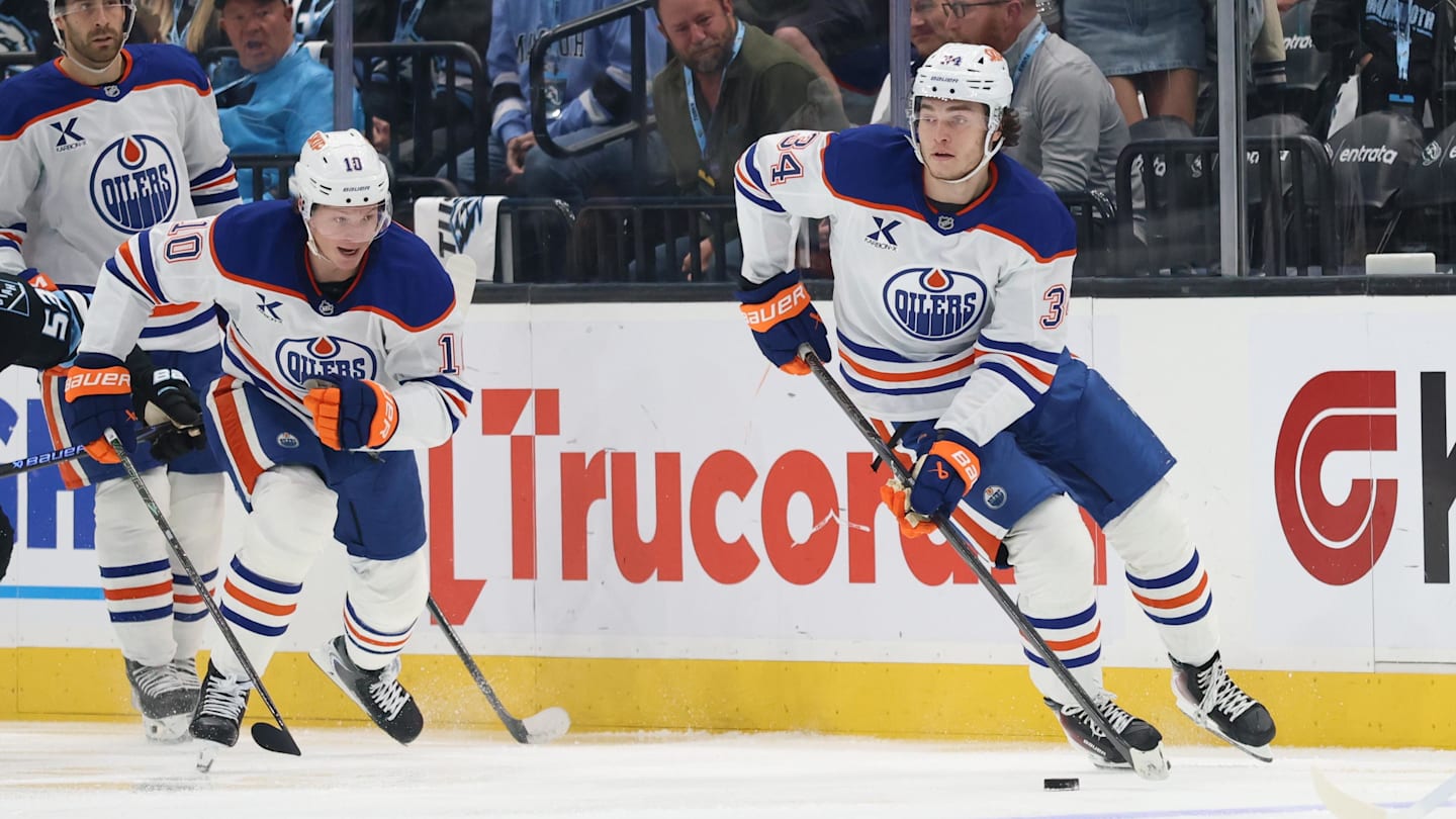Apr 7, 2026; Salt Lake City, Utah, USA; Edmonton Oilers center Colton Dach (34) skates with the puck against the Utah Mammoth during the second period at Delta Center. Mandatory Credit: Rob Gray-Imagn Images