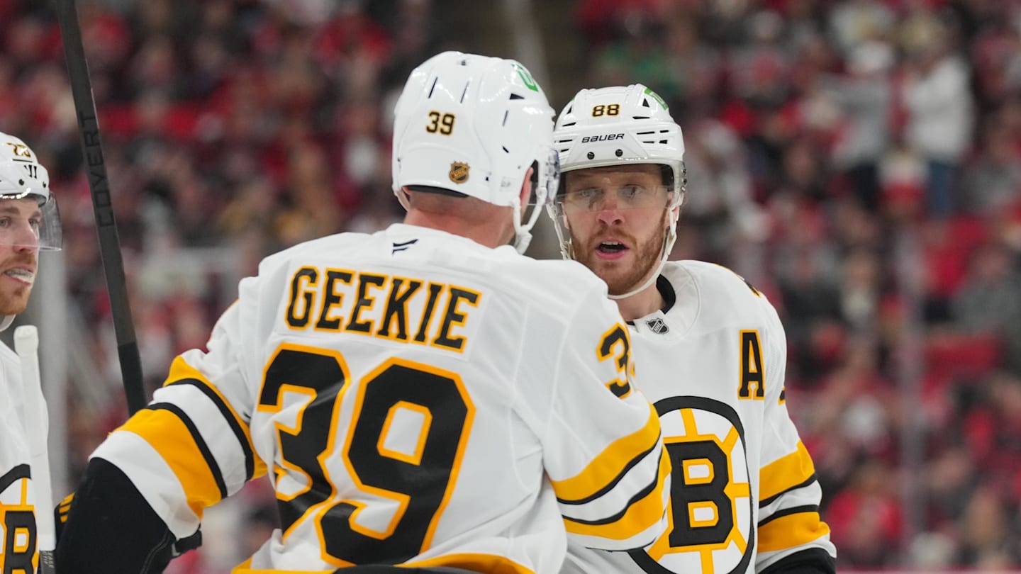 Apr 7, 2026; Raleigh, North Carolina, USA;  Boston Bruins center Morgan Geekie (39) celebrates his goal with right wing David Pastrnak (88) against the Carolina Hurricanes during the second period at Lenovo Center. Mandatory Credit: James Guillory-Imagn Images