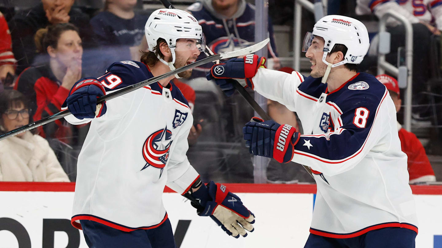 Apr 7, 2026; Detroit, Michigan, USA;  Columbus Blue Jackets center Adam Fantilli (19) right defenseman Zach Werenski (8) after scoring in the third period against the Detroit Red Wingsat Little Caesars Arena. Mandatory Credit: Rick Osentoski-Imagn Images