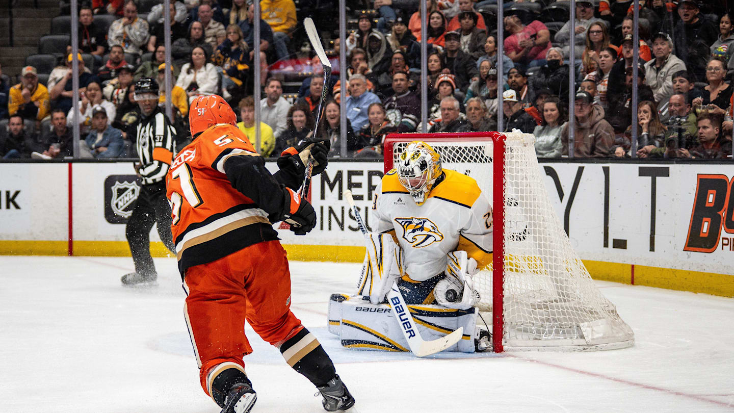 Apr 4, 2026; Anaheim, California, USA; Anaheim Ducks defenseman Olen Zellweger (51) takes a shot on goal during the second period against the Nashville Predators at Honda Center. Nashville Predators goaltender Justus Annunen (29) blocks the shot Mandatory Credit: Corinne Votaw-Imagn Images