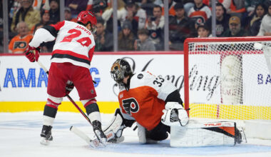 Dec 13, 2025; Philadelphia, Pennsylvania, USA; Philadelphia Flyers goalie Samuel Ersson (33) saves a shootout attempt against Carolina Hurricanes center Seth Jarvis (24) in overtime at Xfinity Mobile Arena. Mandatory Credit: Kyle Ross-Imagn Images