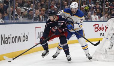 Jan 3, 2026; Columbus, Ohio, USA; Columbus Blue Jackets center Charlie Coyle (3) and Buffalo Sabres defenseman Mattias Samuelsson (23) battle for the loose puck during the second period at Nationwide Arena. Mandatory Credit: Russell LaBounty-Imagn Images