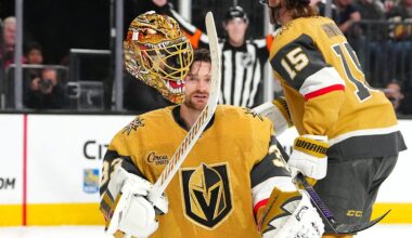 Mar 28, 2026; Las Vegas, Nevada, USA; Vegas Golden Knights goaltender Adin Hill (33) flips his helmet off after a Washington Capitals shot breaks one of the straps during an overtime period at T-Mobile Arena. Mandatory Credit: Stephen R. Sylvanie-Imagn Images