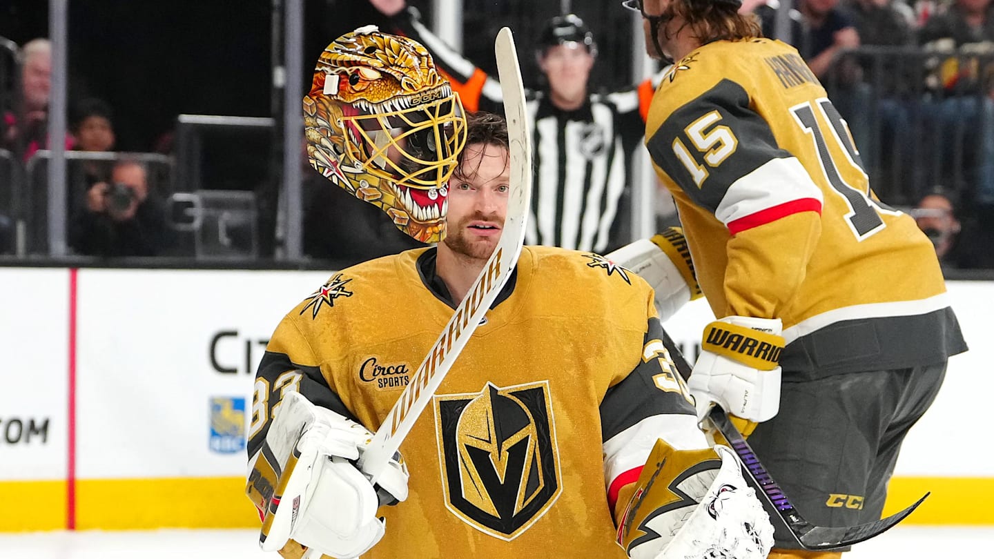 Mar 28, 2026; Las Vegas, Nevada, USA; Vegas Golden Knights goaltender Adin Hill (33) flips his helmet off after a Washington Capitals shot breaks one of the straps during an overtime period at T-Mobile Arena. Mandatory Credit: Stephen R. Sylvanie-Imagn Images