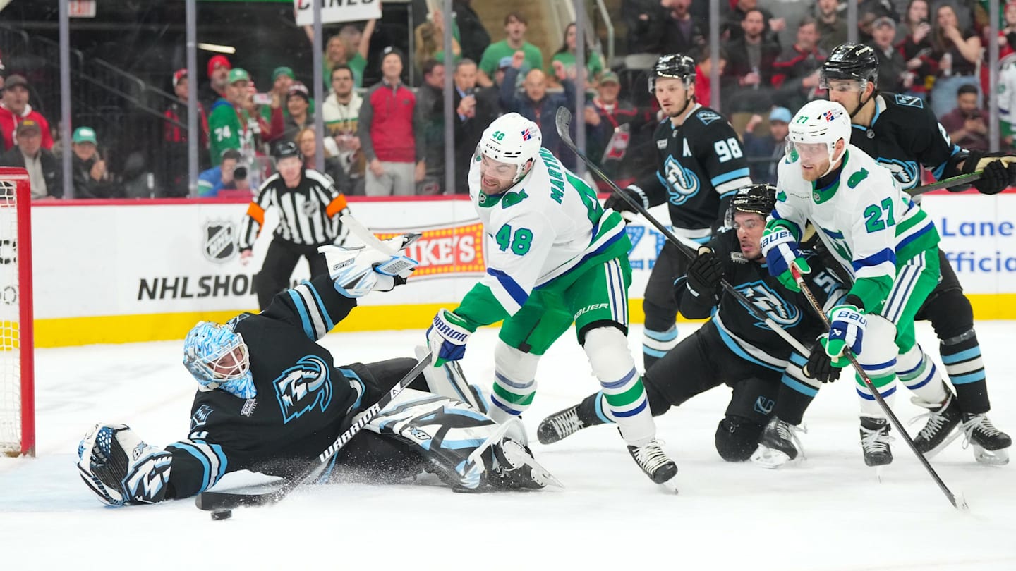 Jan 29, 2026; Raleigh, North Carolina, USA;  Carolina Hurricanes left wing Jordan Martinook (48) misses on his scoring attempt against Utah Mammoth goaltender Karel Vejmelka (70) during the third period at Lenovo Center. Mandatory Credit: James Guillory-Imagn Images
