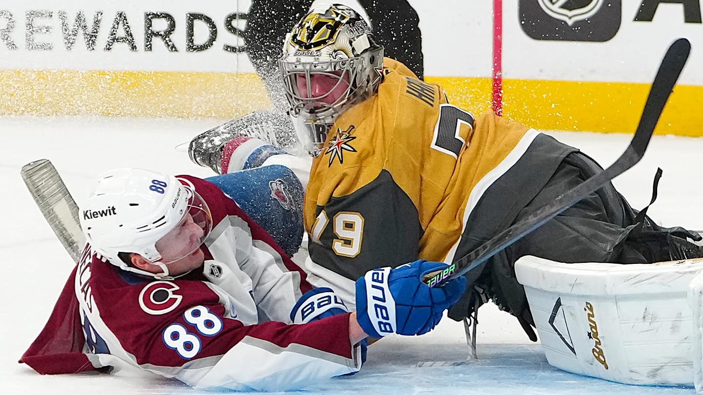 Dec 27, 2025; Las Vegas, Nevada, USA; Colorado Avalanche center Martin Necas (88) collides with Vegas Golden Knights goaltender Carter Hart (79) after scoring a goal during a shoot out at T-Mobile Arena. Mandatory Credit: Stephen R. Sylvanie-Imagn Images