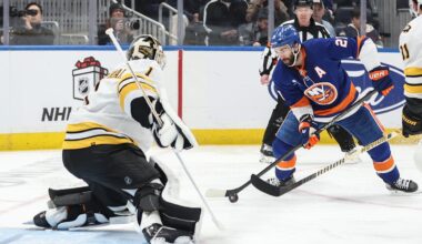 Nov 26, 2025; Elmont, New York, USA; Boston Bruins goaltender Jeremy Swayman (1) defends against a shot on goal attempt from New York Islanders center Kyle Palmieri (21) in the second period at UBS Arena. Mandatory Credit: Wendell Cruz-Imagn Images