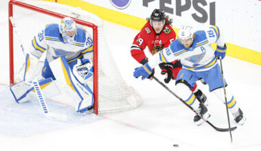 Apr 11, 2026; Chicago, Illinois, USA; St. Louis Blues center Robert Thomas (18) defends against Chicago Blackhawks left wing Tyler Bertuzzi (59) during the second period at United Center. Mandatory Credit: Kamil Krzaczynski-Imagn Images