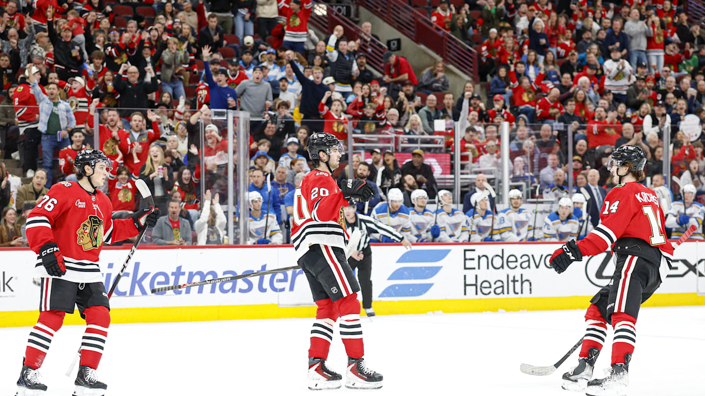 Apr 11, 2026; Chicago, Illinois, USA; Chicago Blackhawks center Ryan Greene (20) reacts after scoring against the St. Louis Blues during the first period at United Center. Mandatory Credit: Kamil Krzaczynski-Imagn Images