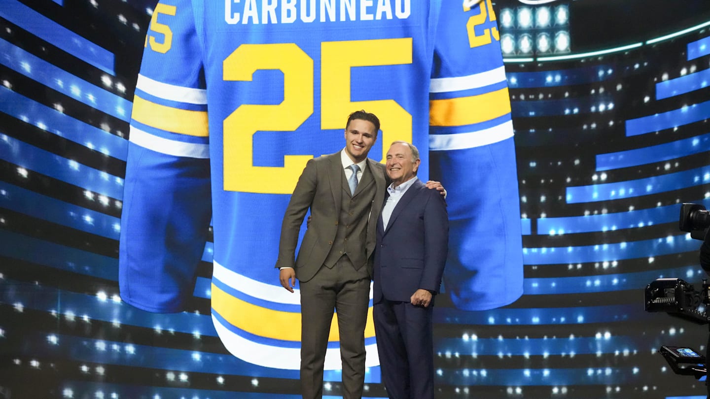 Jun 27, 2025; Los Angeles, California, USA; Justin Carbonneau is selected as the 19th overall pick to the St. Louis Blues in the first round of the 2025 NHL Draft at Peacock Theater. Mandatory Credit: Kirby Lee-Imagn Images