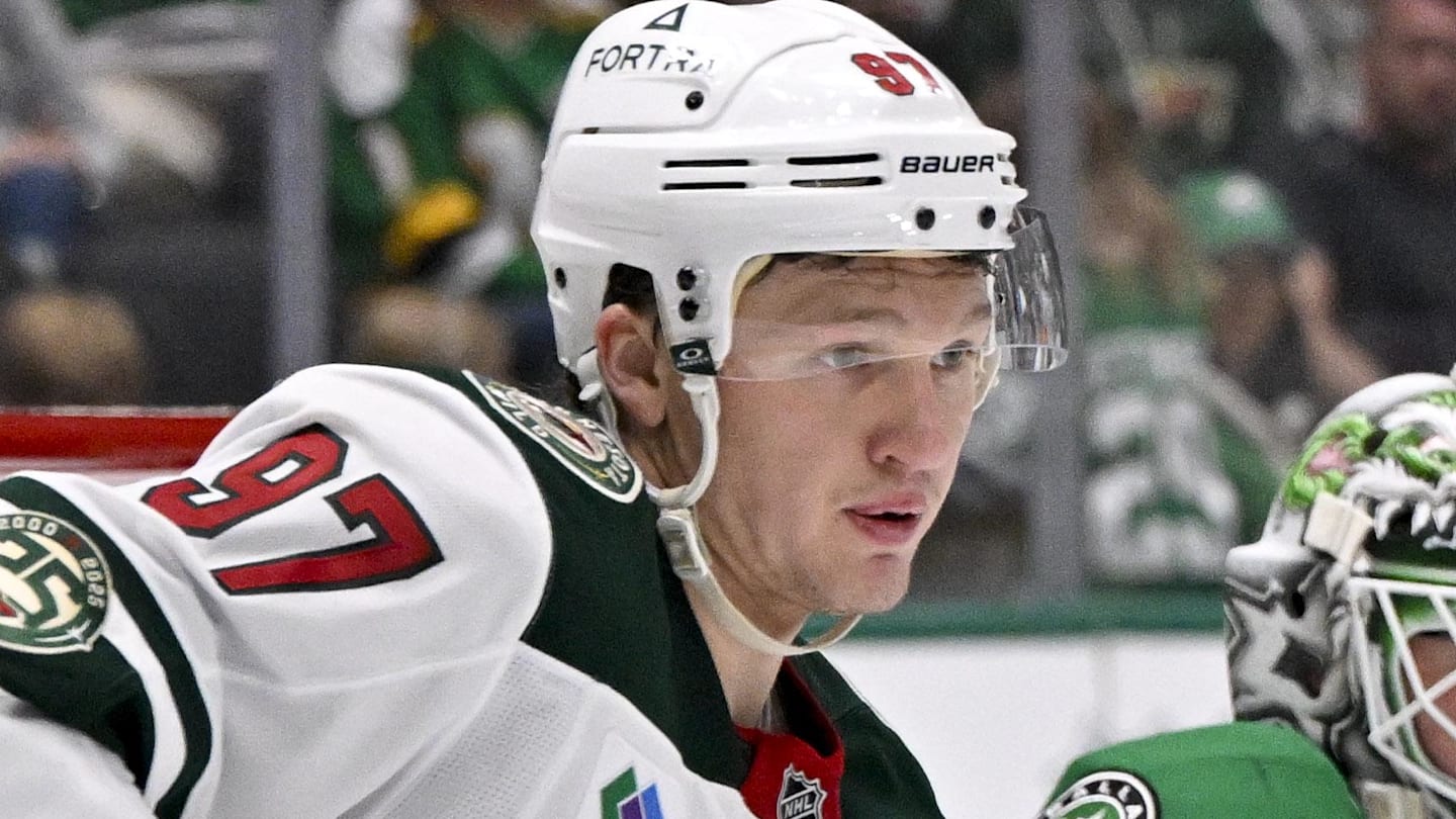 Apr 9, 2026; Dallas, Texas, USA; Minnesota Wild left wing Kirill Kaprizov (97) and Dallas Stars goaltender Jake Oettinger (29) look for the puck during the game between the Stars and the Wild at American Airlines Center. Mandatory Credit: Jerome Miron-Imagn Images