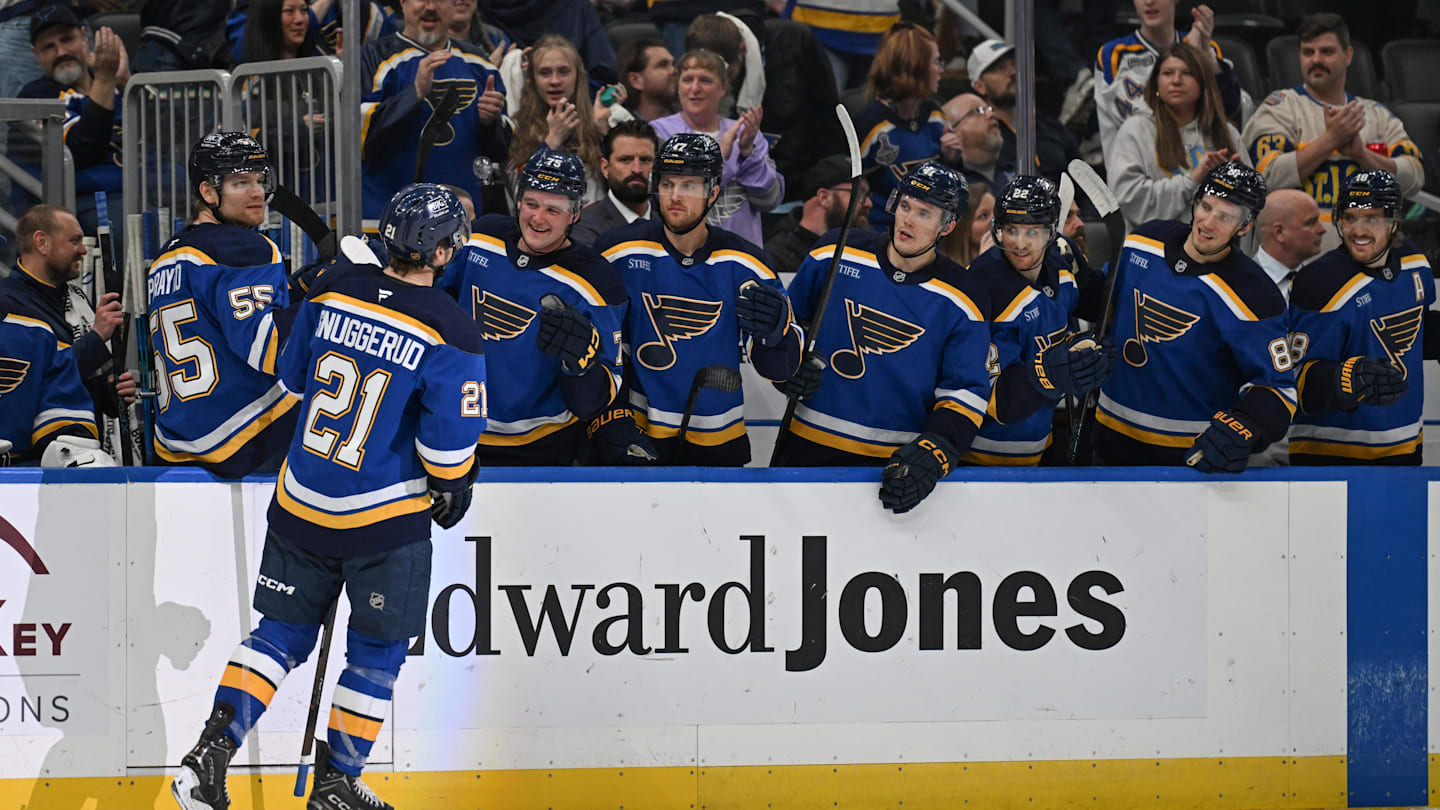 Apr 13, 2026; St. Louis, Missouri, USA; St. Louis Blues right wing Jimmy Snuggerud (21) is congratulated after scoring an empty net goal against the Minnesota Wild in the third period at Enterprise Center. Mandatory Credit: Joe Puetz-Imagn Images