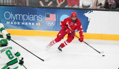 Apr 9, 2026; Las Vegas, Nevada, UNITED STATES; Wisconsin Badgers forward Blake Montgomery (47) moves the puck in the second period against the North Dakota Fighting Hawks in the semifinals of the NCAA men's ice hockey Frozen Four at T-Mobile Arena. Mandatory Credit: Lucas Peltier-Imagn Images