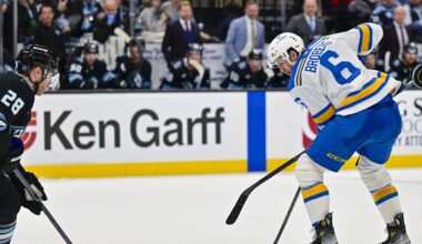 Jan 9, 2026; Salt Lake City, Utah, USA; Utah Mammoth defenseman Ian Cole (28) looks to defend the center from St. Louis Blues defenseman Philip Broberg (6) during third period at Delta Center. Mandatory Credit: Peter Creveling-Imagn Images