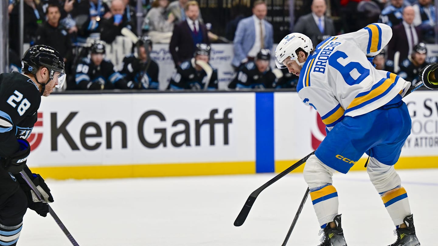 Jan 9, 2026; Salt Lake City, Utah, USA; Utah Mammoth defenseman Ian Cole (28) looks to defend the center from St. Louis Blues defenseman Philip Broberg (6) during third period at Delta Center. Mandatory Credit: Peter Creveling-Imagn Images
