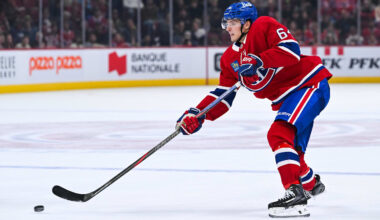 Sep 25, 2025; Montreal, Quebec, CAN; Montreal Canadiens defenseman David Reinbacher (64) shoots the puck Toronto Maple Leafs during the third period at Bell Centre. Mandatory Credit: David Kirouac-Imagn Images