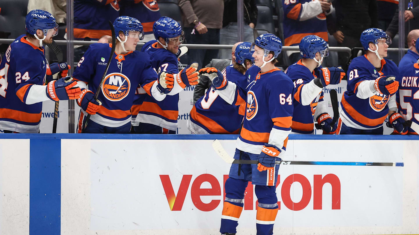 Apr 9, 2026; Elmont, New York, USA;  New York Islanders center Calum Ritchie (64) celebrates with teammates after scoring a goal in the third period against the Toronto Maple Leafs at UBS Arena. Mandatory Credit: Wendell Cruz-Imagn Images