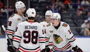 Mar 24, 2026; Elmont, New York, USA; Chicago Blackhawks center Anton Frondell (15) talks to center Connor Bedard (98) and defenseman Alex Vlasic (72) during the third period at UBS Arena. Mandatory Credit: Brad Penner-Imagn Images