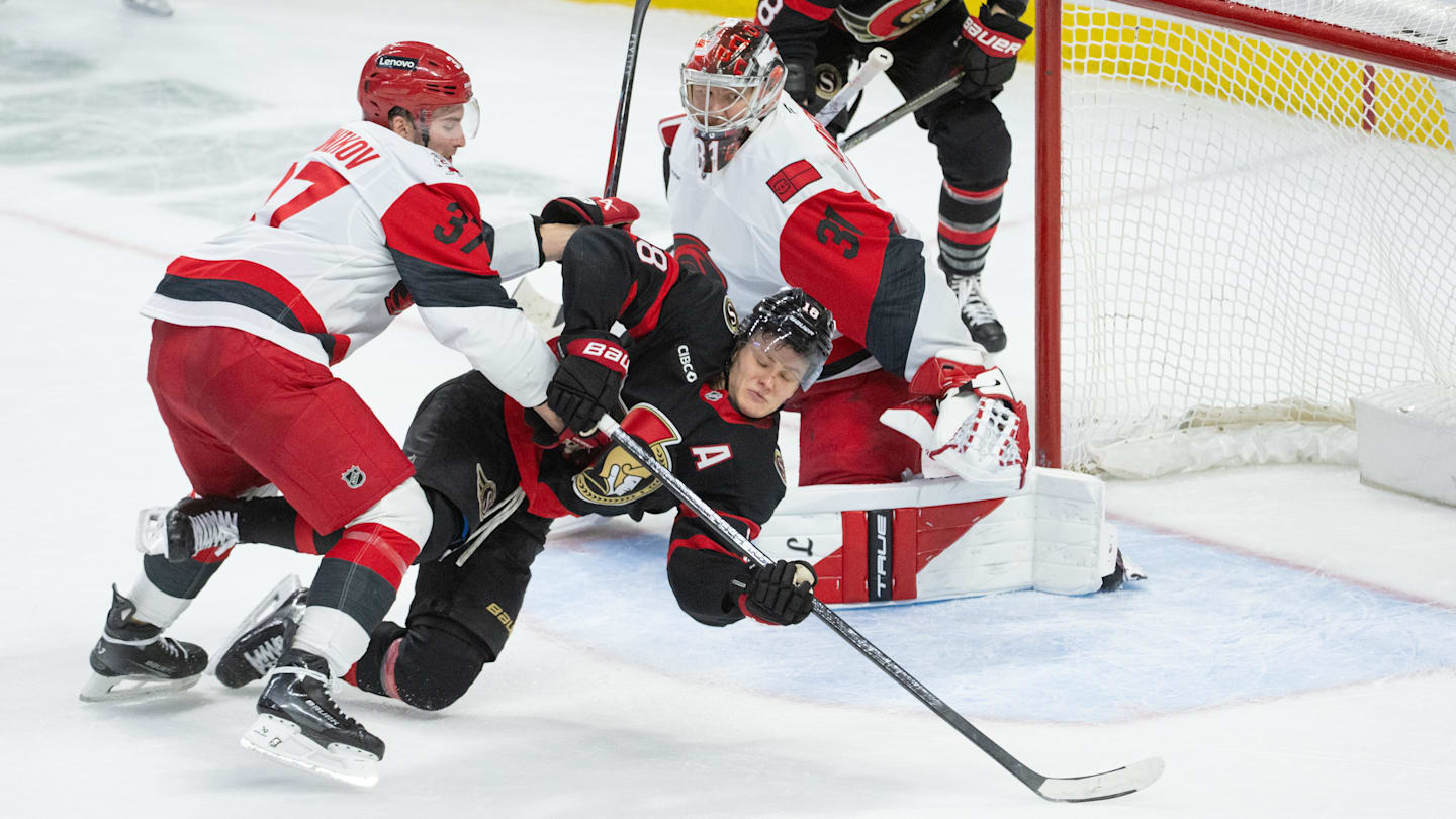 Apr 5, 2026; Ottawa, Ontario, CAN; Carolina Hurricanes right wing Andrei Svechnikov (37) takes Ottawa Senators center Tim Stutzle (18) off the puck in the third period at the Canadian Tire Centre. Mandatory Credit: Marc DesRosiers-IMAGN Images